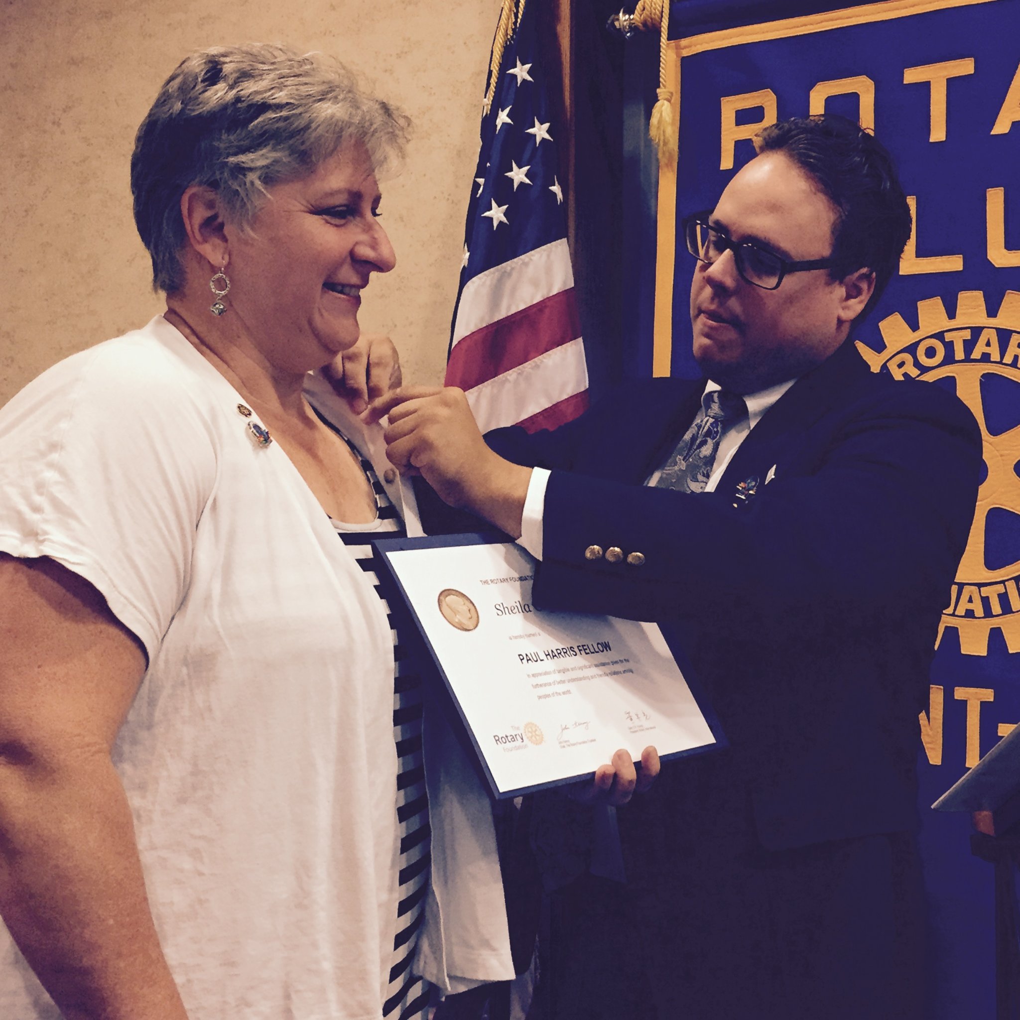 Matthew Dowling presenting a Paul Harris Fellow award at Rotary